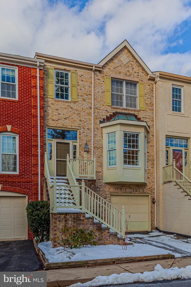 townhome / multi-family property featuring a garage