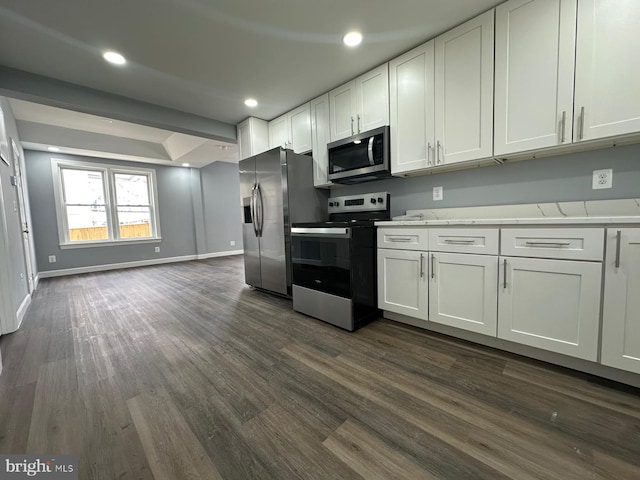 kitchen featuring white cabinets, stainless steel appliances, and dark hardwood / wood-style floors