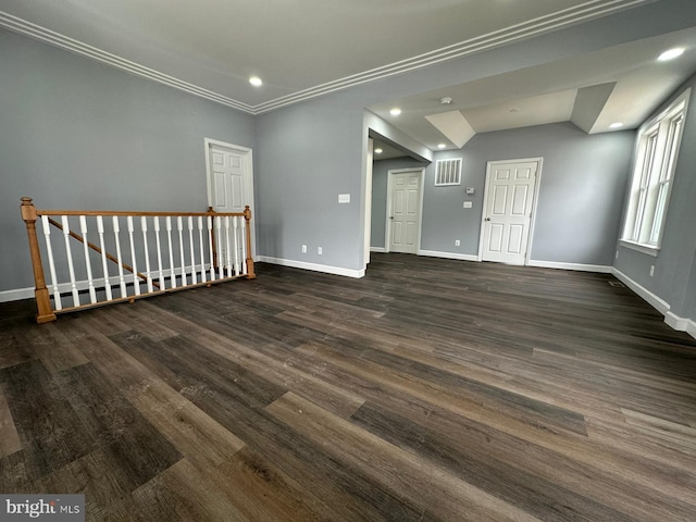 interior space featuring crown molding and dark hardwood / wood-style floors