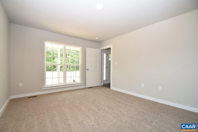 empty room featuring carpet floors