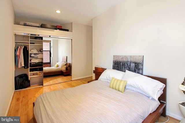 bedroom featuring light hardwood / wood-style floors and a closet