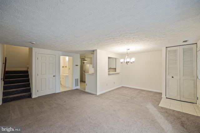 interior space featuring light carpet and an inviting chandelier