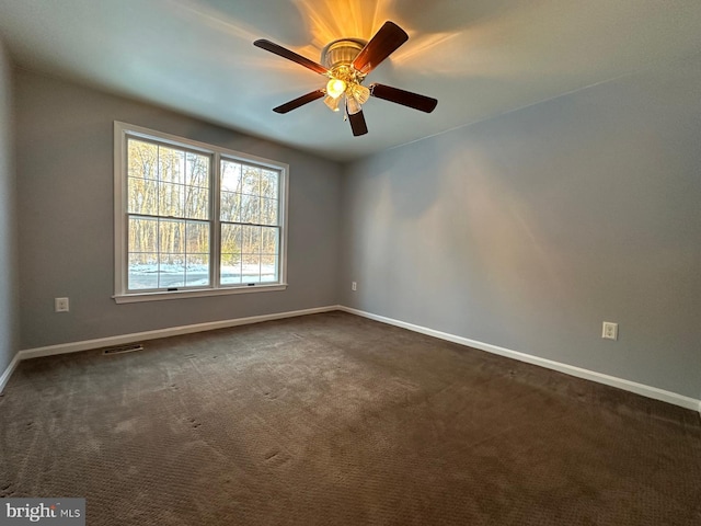 carpeted empty room with ceiling fan