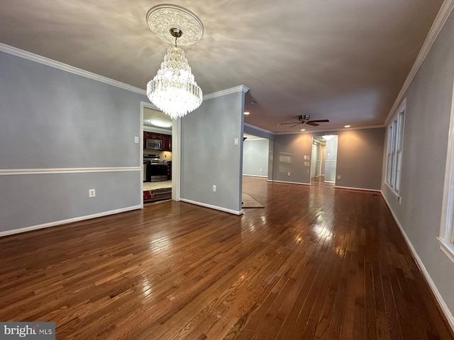 interior space with dark hardwood / wood-style flooring, ceiling fan with notable chandelier, and ornamental molding