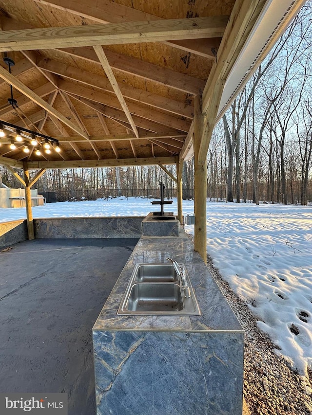 snow covered patio with sink