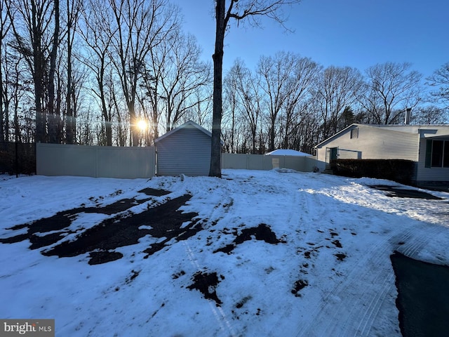 view of yard layered in snow