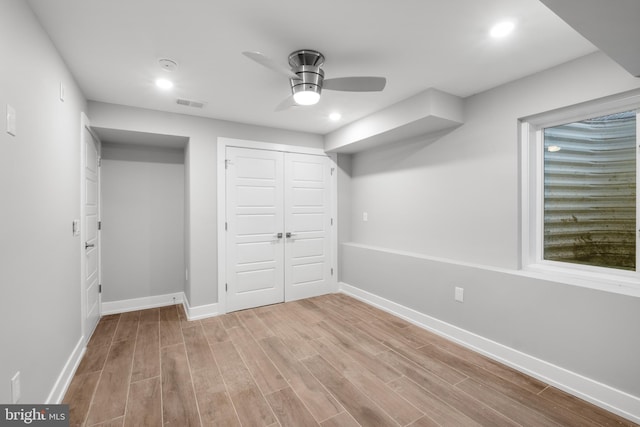 unfurnished bedroom with a closet, ceiling fan, and light hardwood / wood-style floors