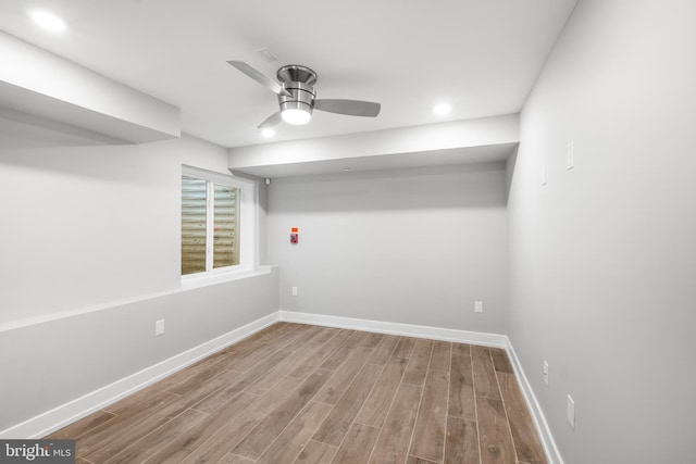 unfurnished room with hardwood / wood-style flooring and ceiling fan