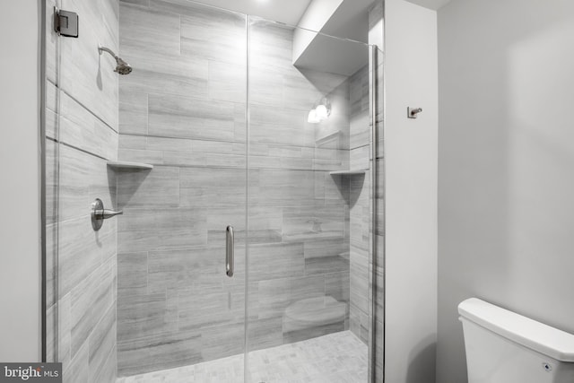 bathroom with walk in shower and toilet