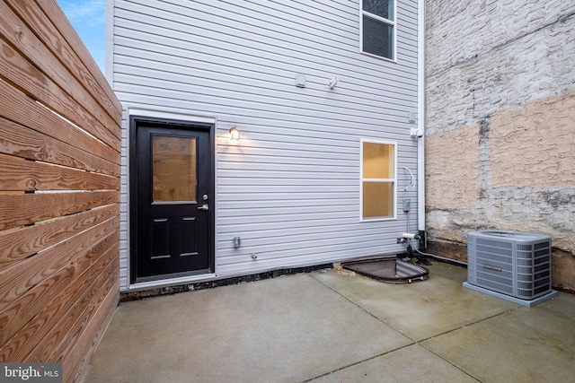 entrance to property featuring central AC unit