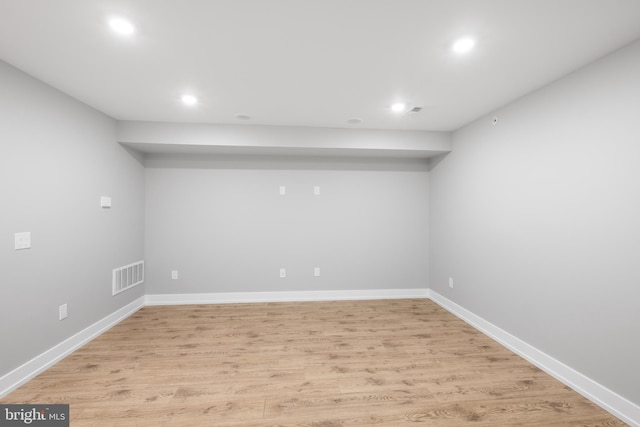 basement featuring light wood-type flooring