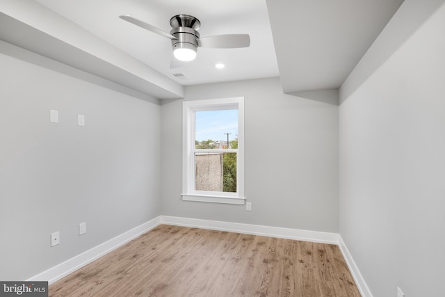 spare room featuring ceiling fan and light hardwood / wood-style flooring