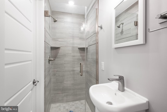 bathroom with sink and walk in shower