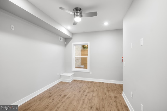 spare room featuring ceiling fan and light hardwood / wood-style flooring