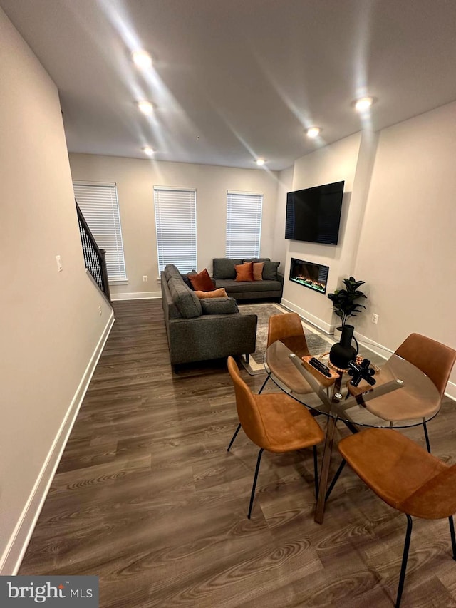 living room featuring dark wood-type flooring