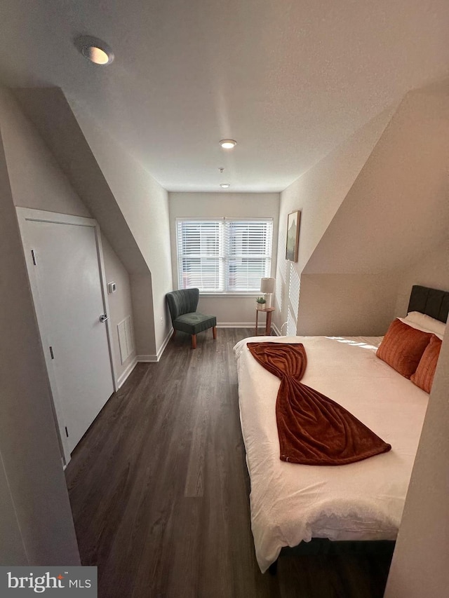 bedroom featuring dark hardwood / wood-style flooring