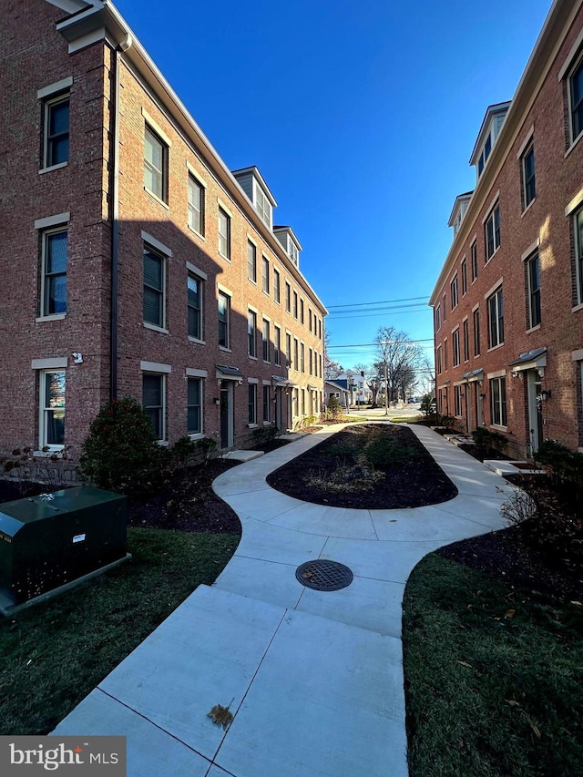 view of property's community featuring a yard