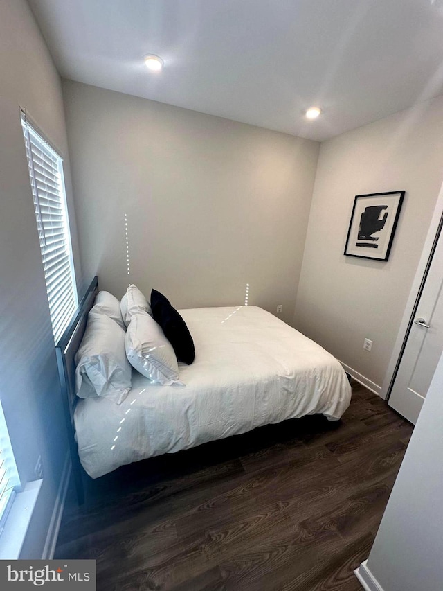 bedroom featuring dark hardwood / wood-style floors