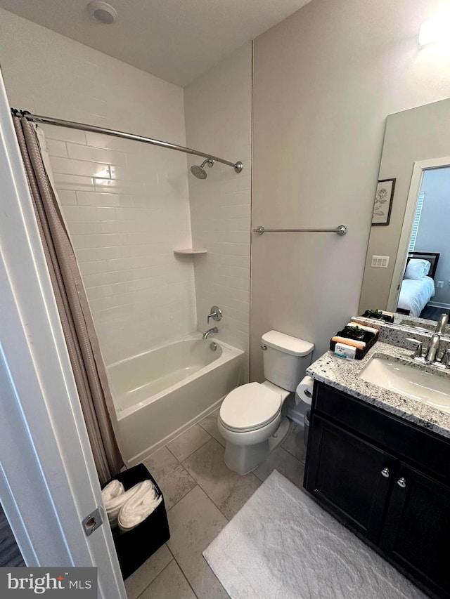 full bathroom featuring tile patterned floors, vanity, shower / tub combo, and toilet