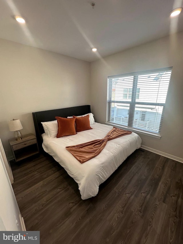 bedroom featuring dark hardwood / wood-style flooring