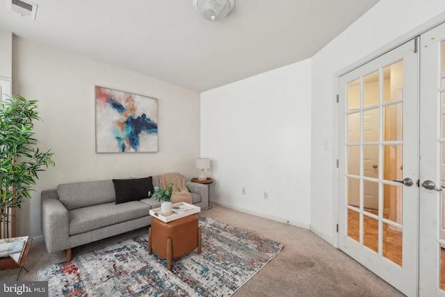 carpeted living room with french doors