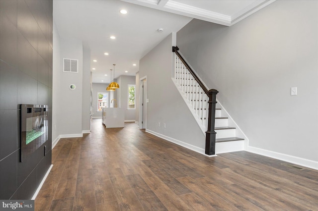 entryway with dark hardwood / wood-style flooring