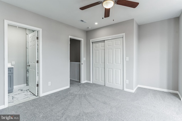 unfurnished bedroom featuring ceiling fan and light colored carpet