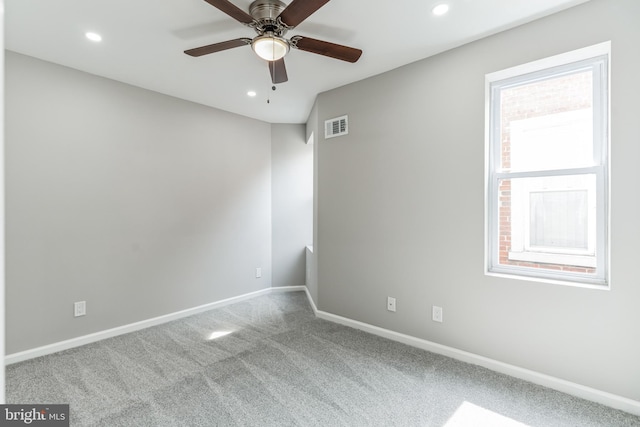 carpeted empty room with ceiling fan