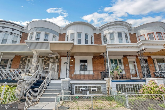 townhome / multi-family property with covered porch