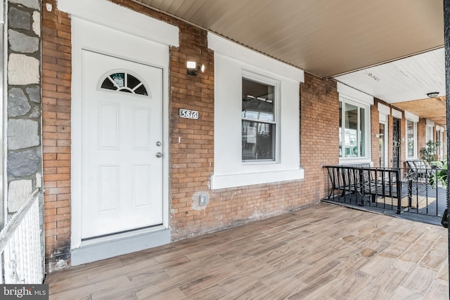 doorway to property featuring a porch