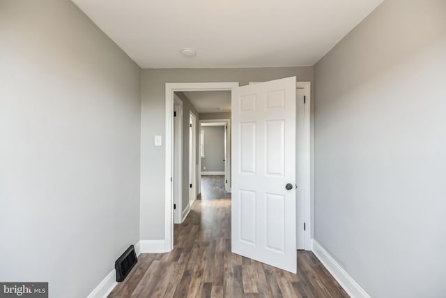 hall featuring dark wood-type flooring