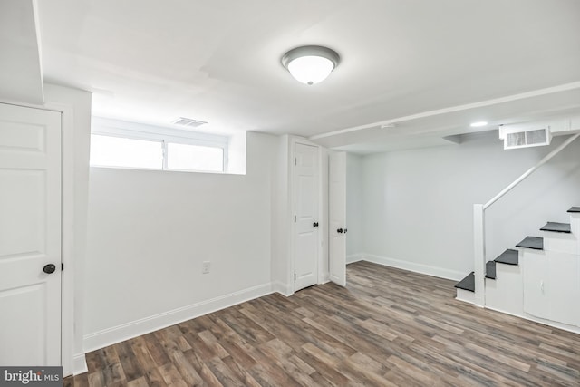 basement featuring dark hardwood / wood-style floors