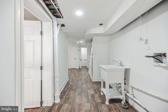 hallway with dark hardwood / wood-style flooring