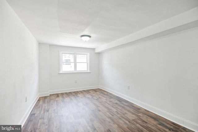 spare room featuring hardwood / wood-style floors