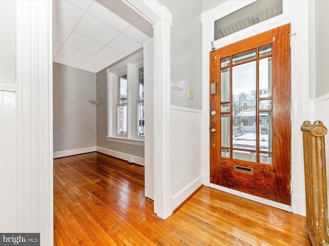 entryway with a paneled ceiling and hardwood / wood-style flooring