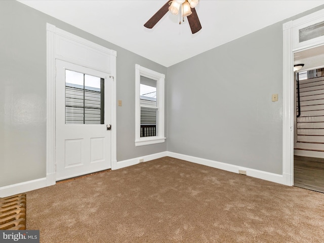 empty room with carpet and ceiling fan