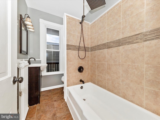 full bathroom with vanity, toilet, and tiled shower / bath