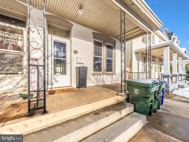 doorway to property with covered porch