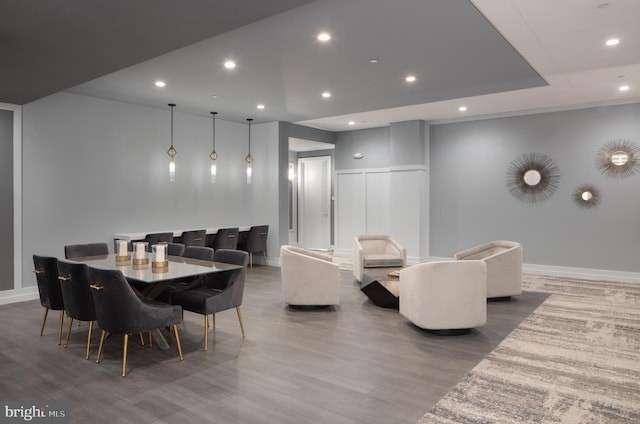 dining space featuring wood-type flooring