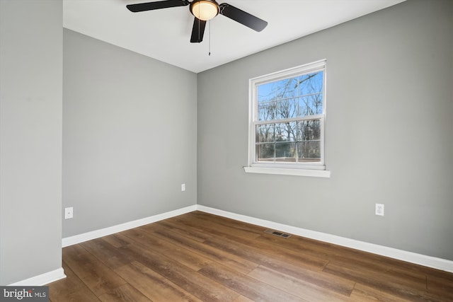 spare room with ceiling fan and hardwood / wood-style floors