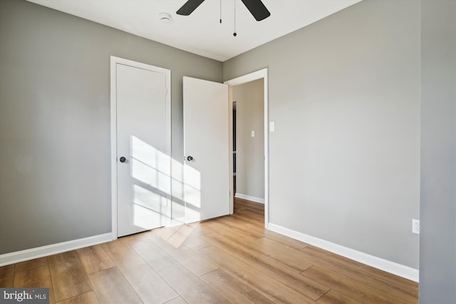 unfurnished bedroom featuring ceiling fan and light hardwood / wood-style floors