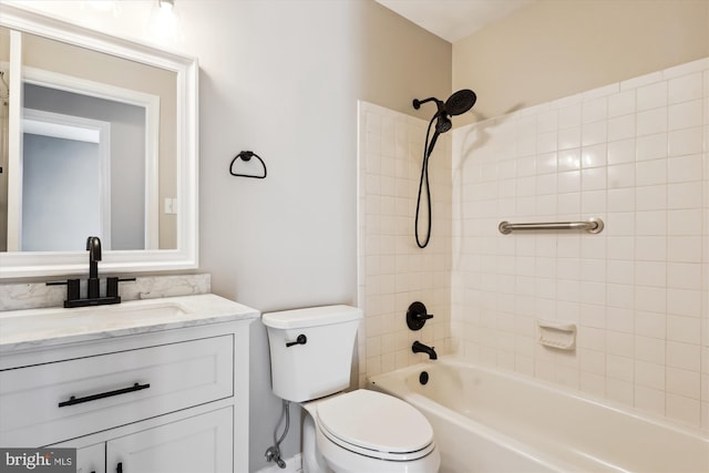 full bathroom with vanity, toilet, and tiled shower / bath