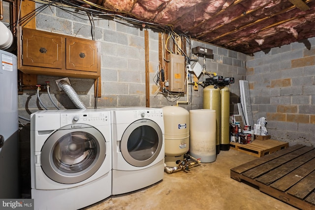 laundry room featuring cabinets, independent washer and dryer, and electric panel