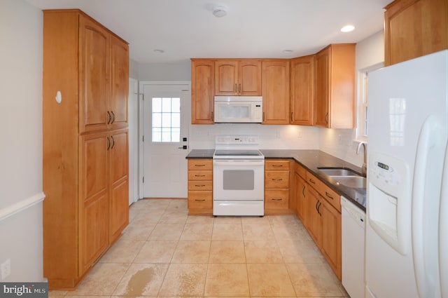 kitchen with sink, light tile patterned floors, and white appliances