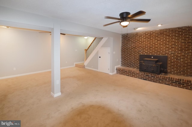 basement featuring a wood stove and light colored carpet