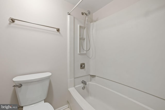 bathroom featuring toilet and shower / bathing tub combination