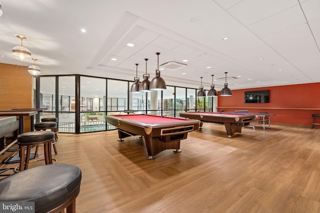 playroom with floor to ceiling windows, a healthy amount of sunlight, light wood-type flooring, and billiards