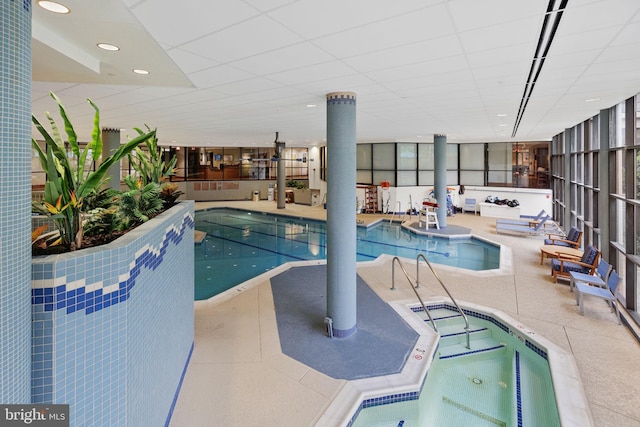 view of swimming pool with an indoor in ground hot tub