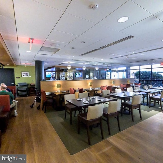 dining area with wood-type flooring