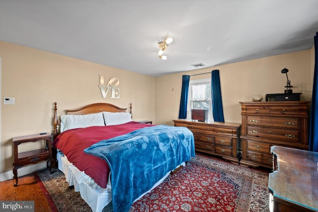 bedroom featuring dark hardwood / wood-style floors